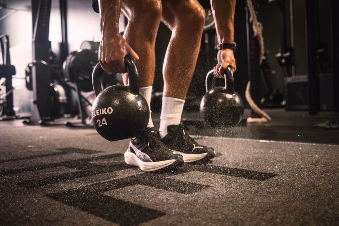 man with weights - Strength Training for Sprinters