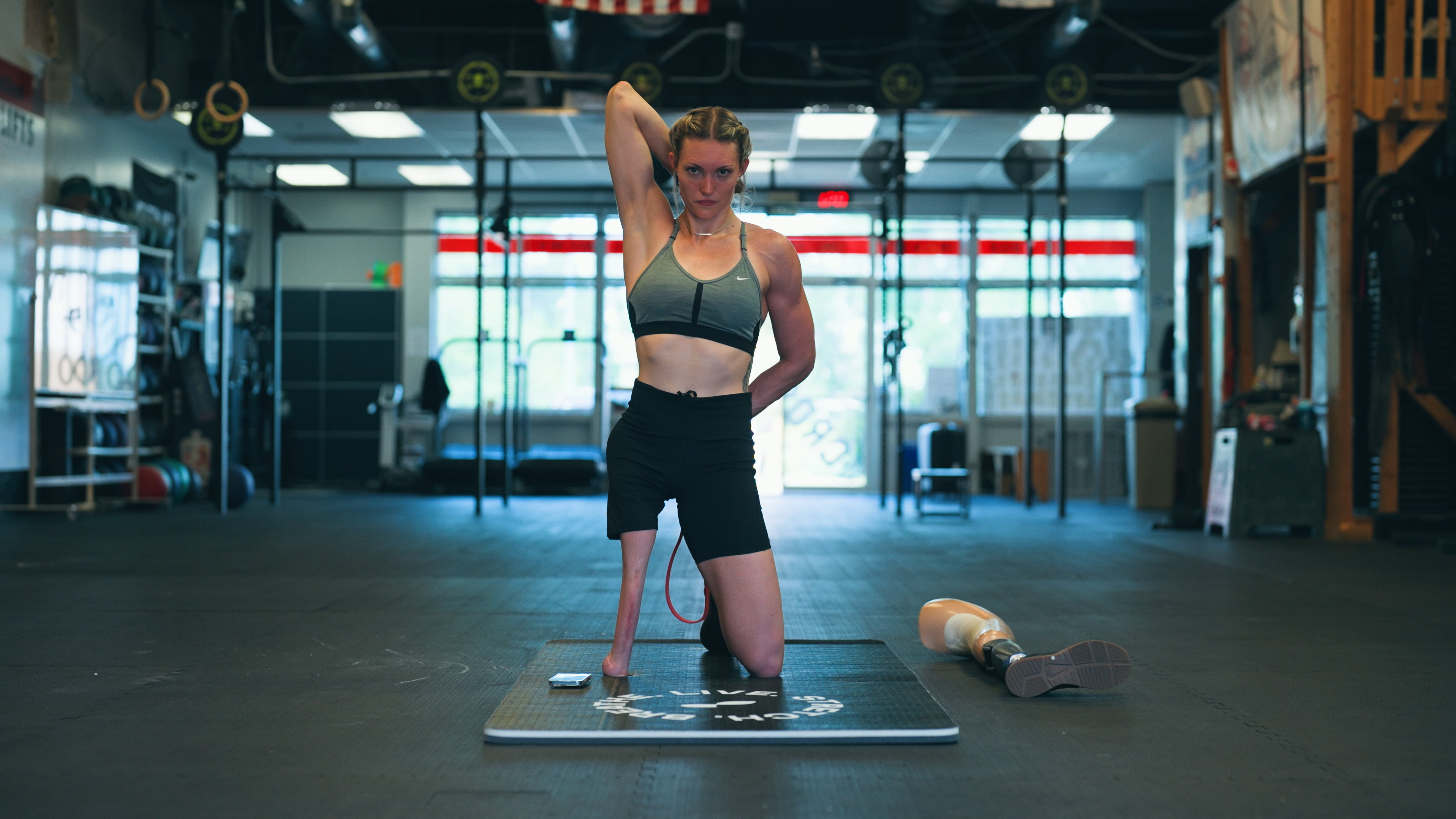 Woman Stretching in Gym - Stretch Before Or After Workout